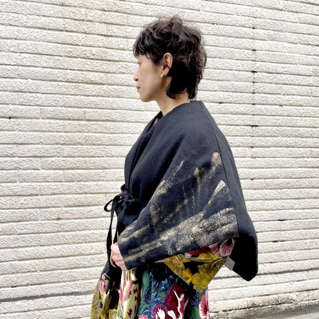 暖かさとセンスを備えたポンチョ。