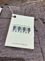 〈Giabsarchivio〉ウールライクなジャージー素材を載せたハウンドトゥース柄パンツ。